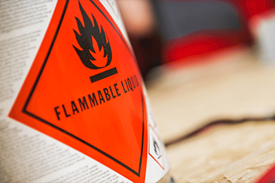 A Can With A Red Warning Label That Says Flammable Liquid Thumb 